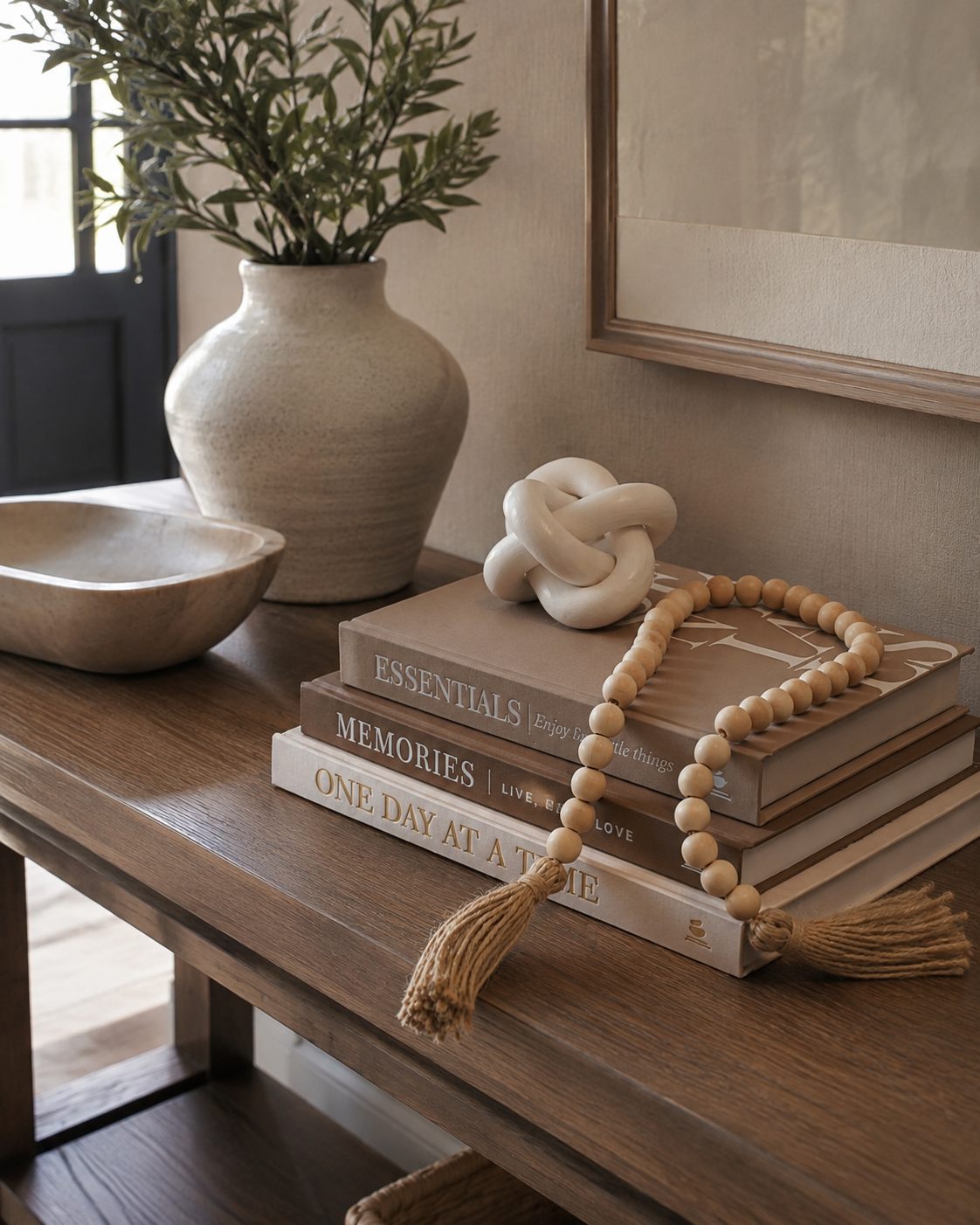 JULZEN book set styled on an entryway console